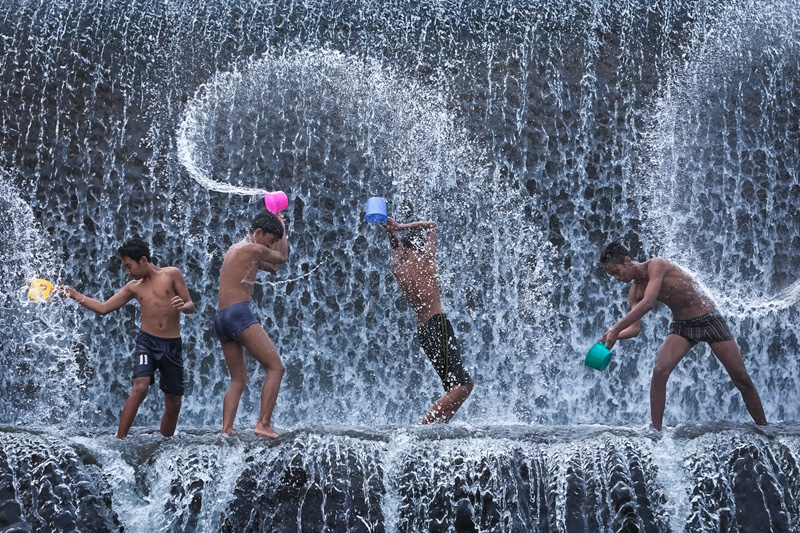 asia,asian,bali,boy,dam,east java,indonesia,indonesian,java,klung kung,male,splashing,swimming,tukad unda river,water,young