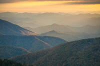 Early evening light strikes the sides of the Cowee Mountains.