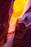 A variety of colors and tones hidden inside a dark slot canyon.