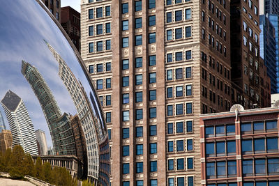Chicago's skyline reflecting in the Bean.