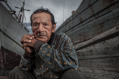 A dock worker in a Jakarta shipyard poses for the camera.