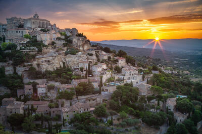 The sun rises over the hilltop to light up a unique city in southern France.