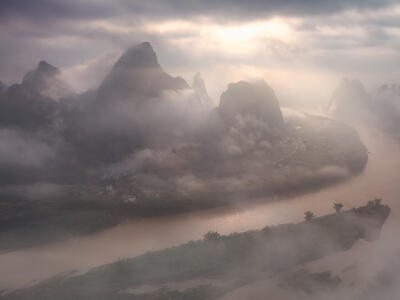 The sun breaking through virtually complete cloud cover to light up an iconic scene.