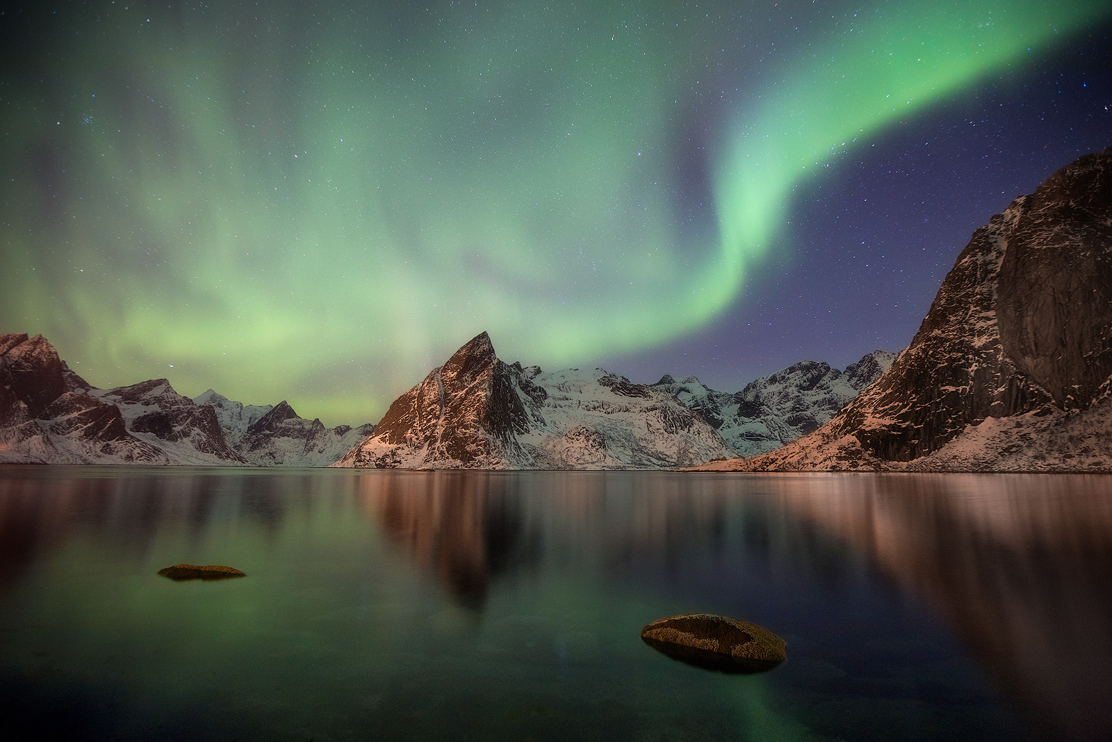 Northern lights on full display over Norway's fjords.