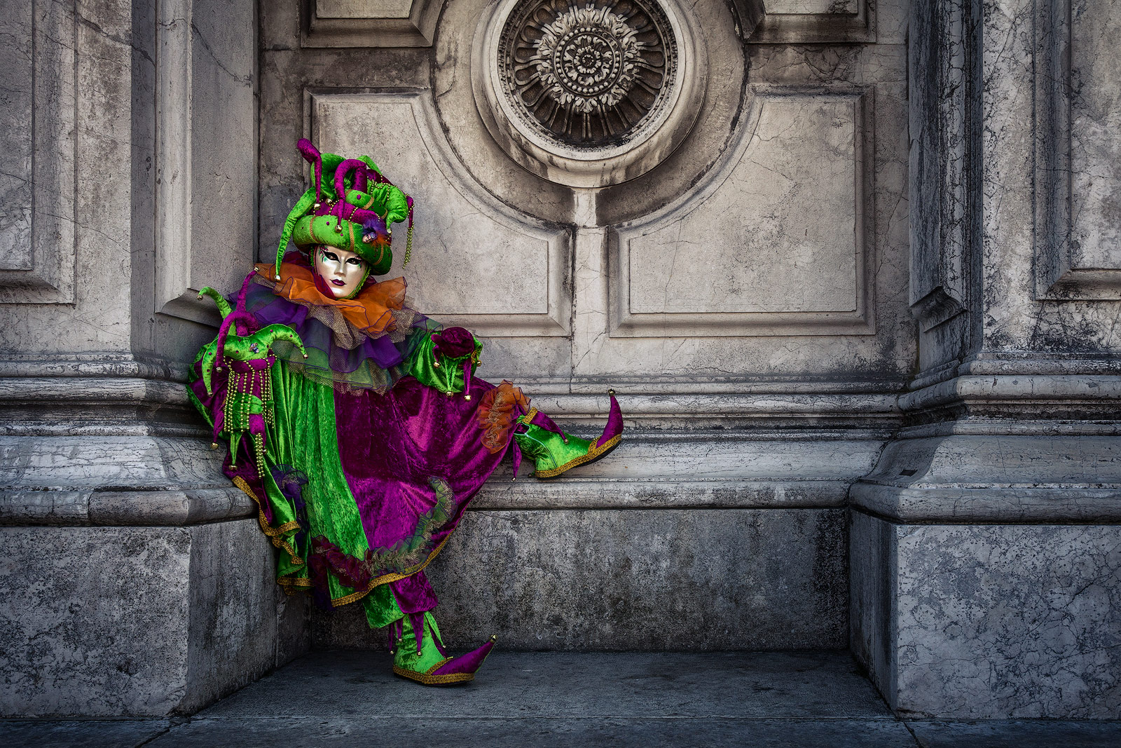 Carnival costumed model sitting outside San Gorgio church.