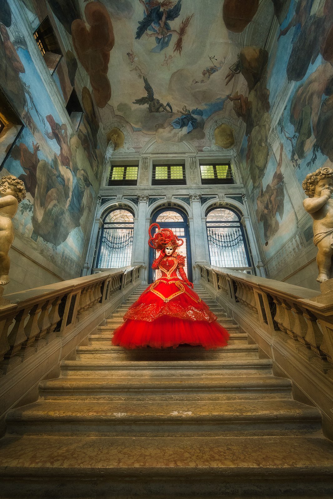 Costumed Carnival model decked out in a gorgeous red dress.
