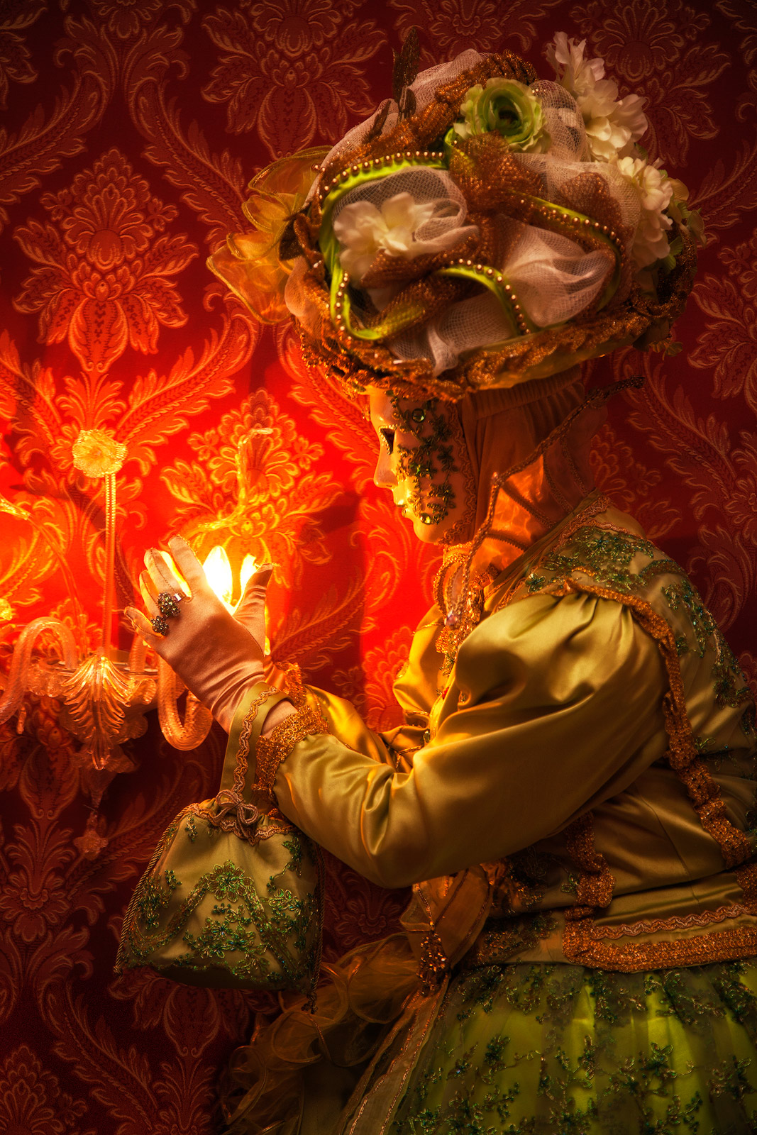 Carnival costumed model in a old-fashioned Venice hotel room.