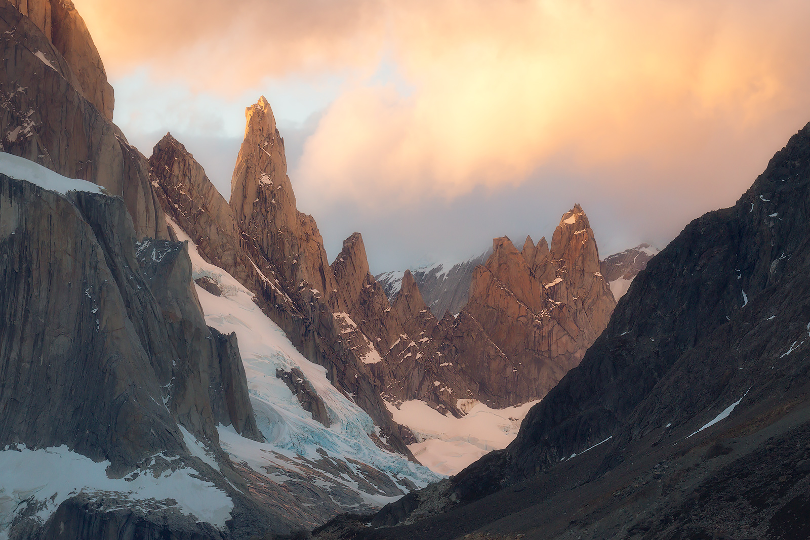 Clouds lighting up over Cerro Torre as seen from Laguna Torre.