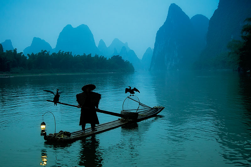 Silhouette of Chinese cormorant fisherman