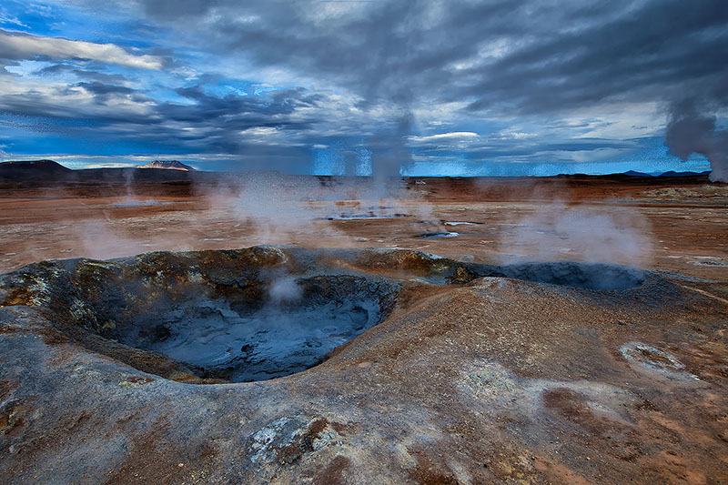 Boiling mud and sulfur pits in a geothermal area of Iceland