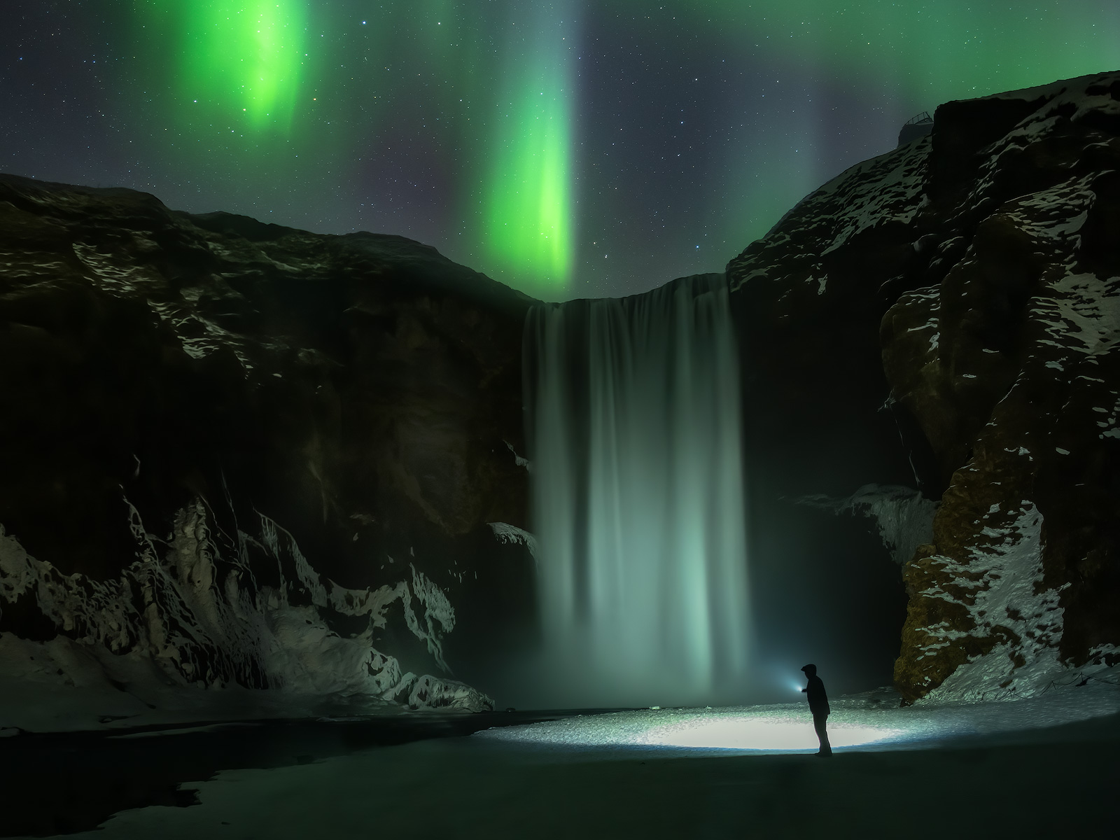 One of Iceland's most iconic waterfalls with a display of northern lights.