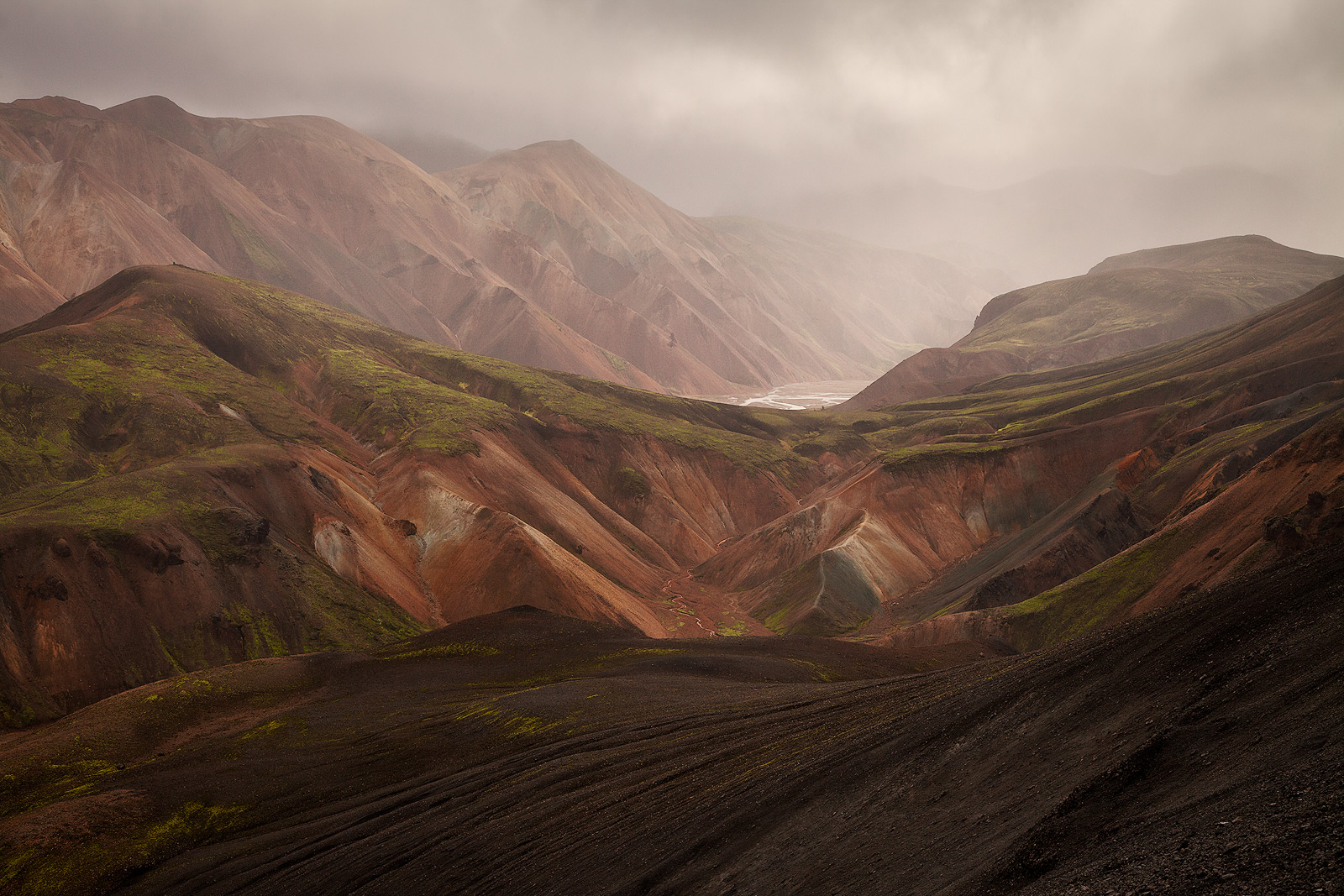 Clouds over sweeping volcanic landscape