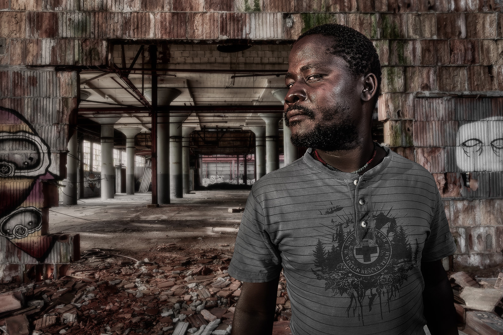 Compositve of a Malawian man in an abandoned factory in Gary, Indiana