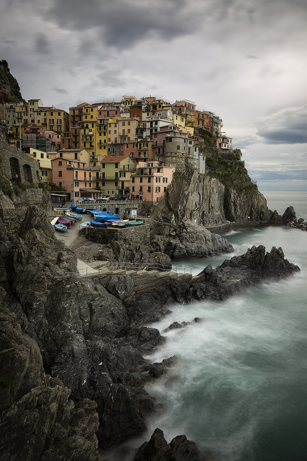 Waves crashing on the shore of Italy's coastline.