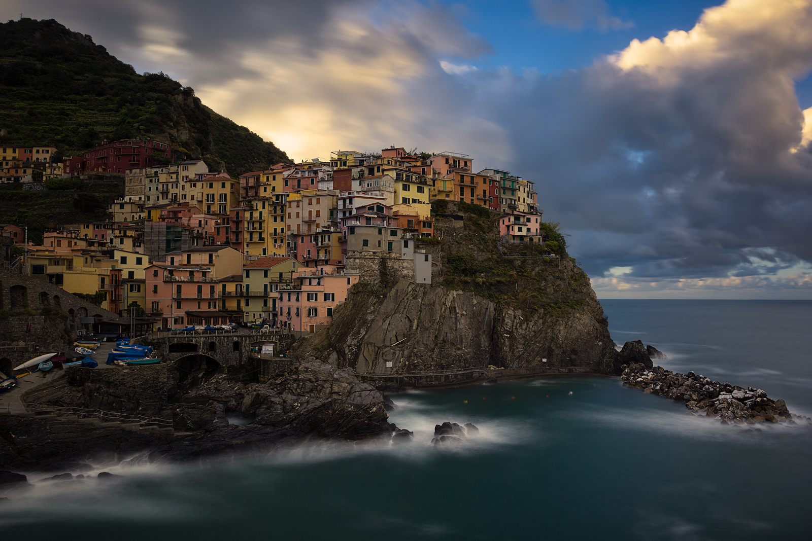 Clouds behind Italy's amazing coastal town Manarola, part of Cinque Terre.