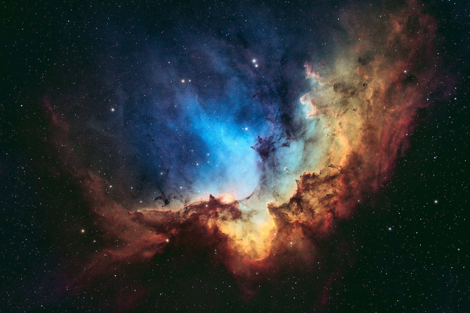 The Wizard Nebula (NGC 7380) is comprised of an emission nebula and star cluster located in the constellation of Cepheus.