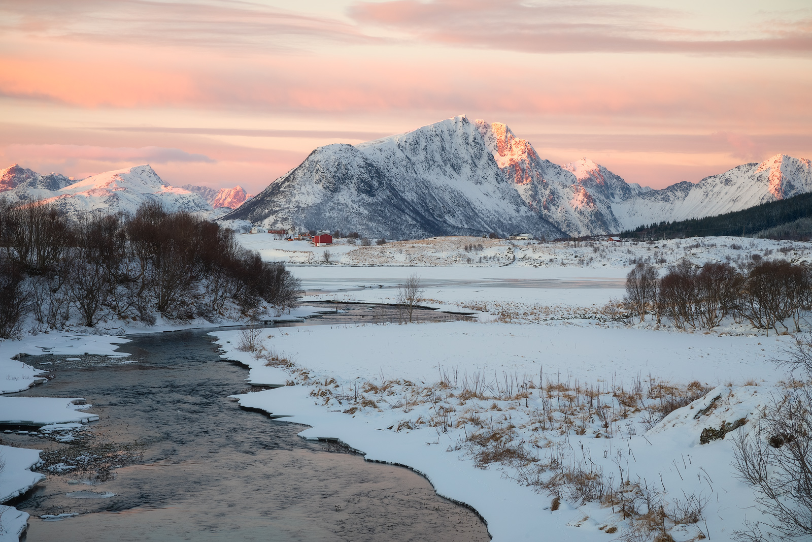 A quintessential Winter scene lights up at sunrise in Lofoten, Norway.
