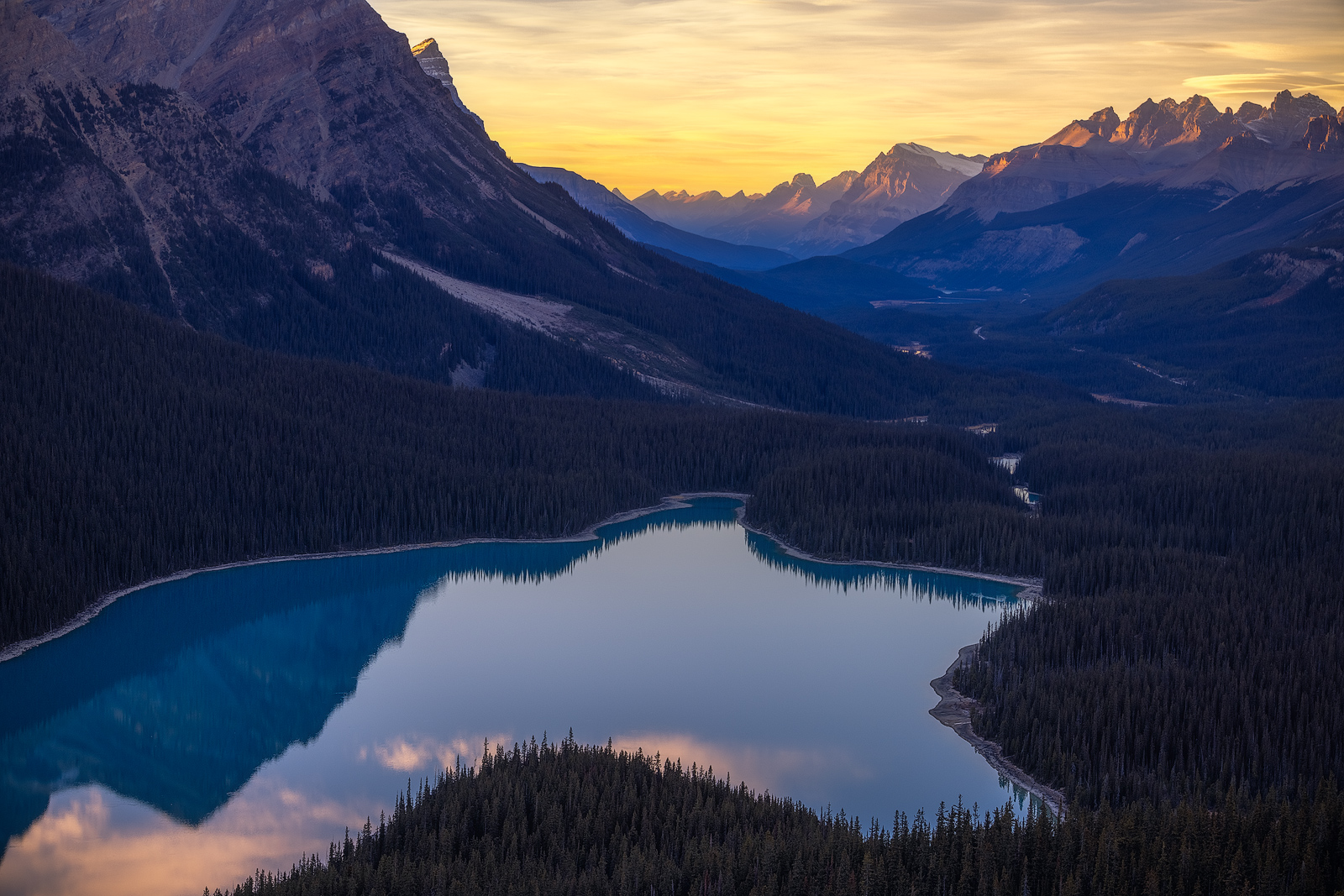 An iconic viewpoint high up in the Canadian Rockies at sunset.