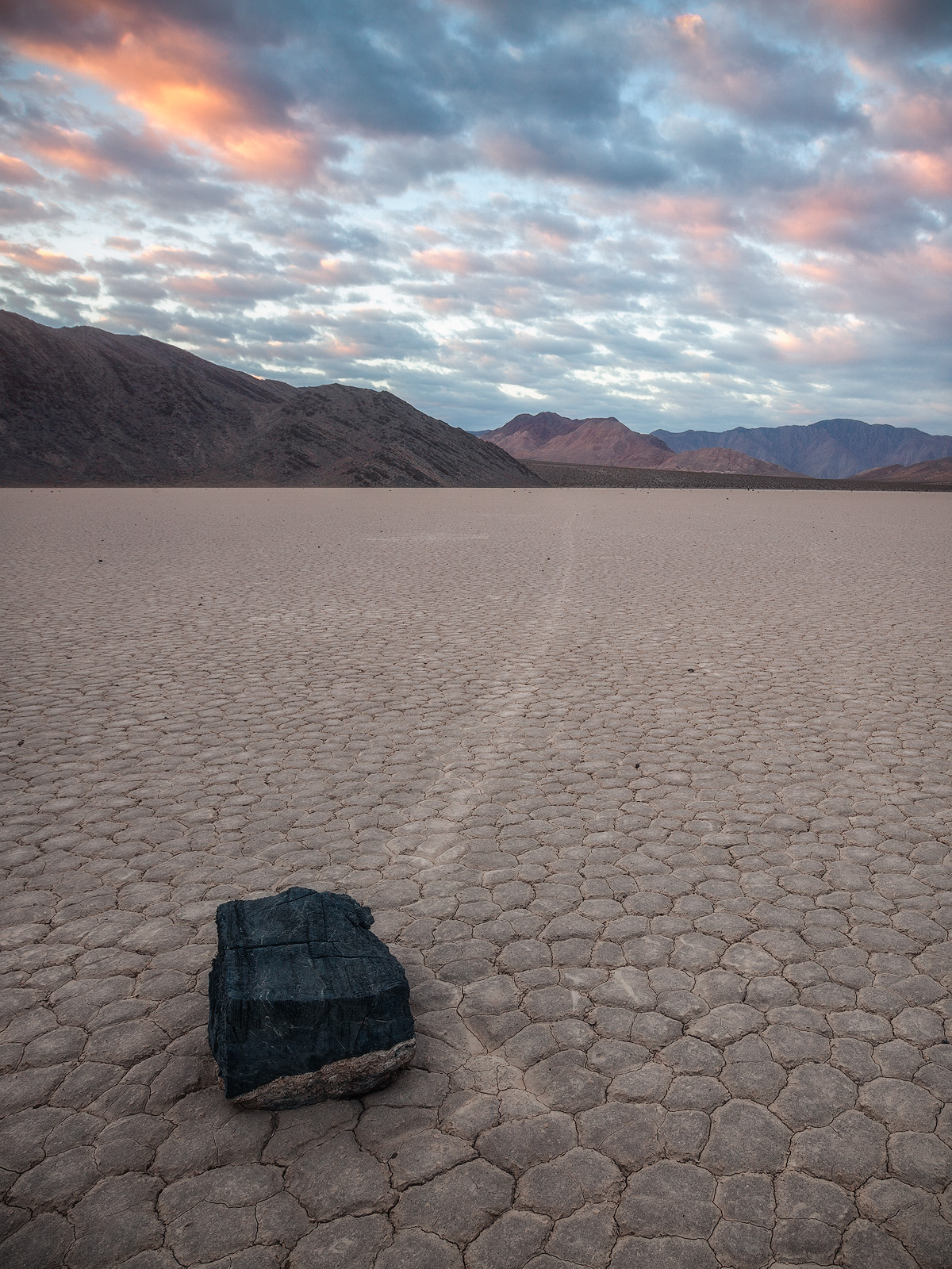 Vertical view of a mysterious moving rock at Death Valley's Racetrack
