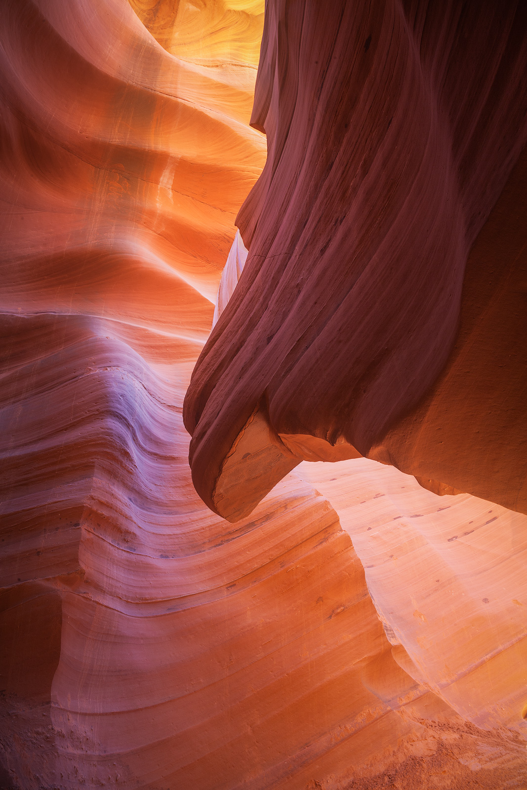 Light pouring into an ornate slot canyon.