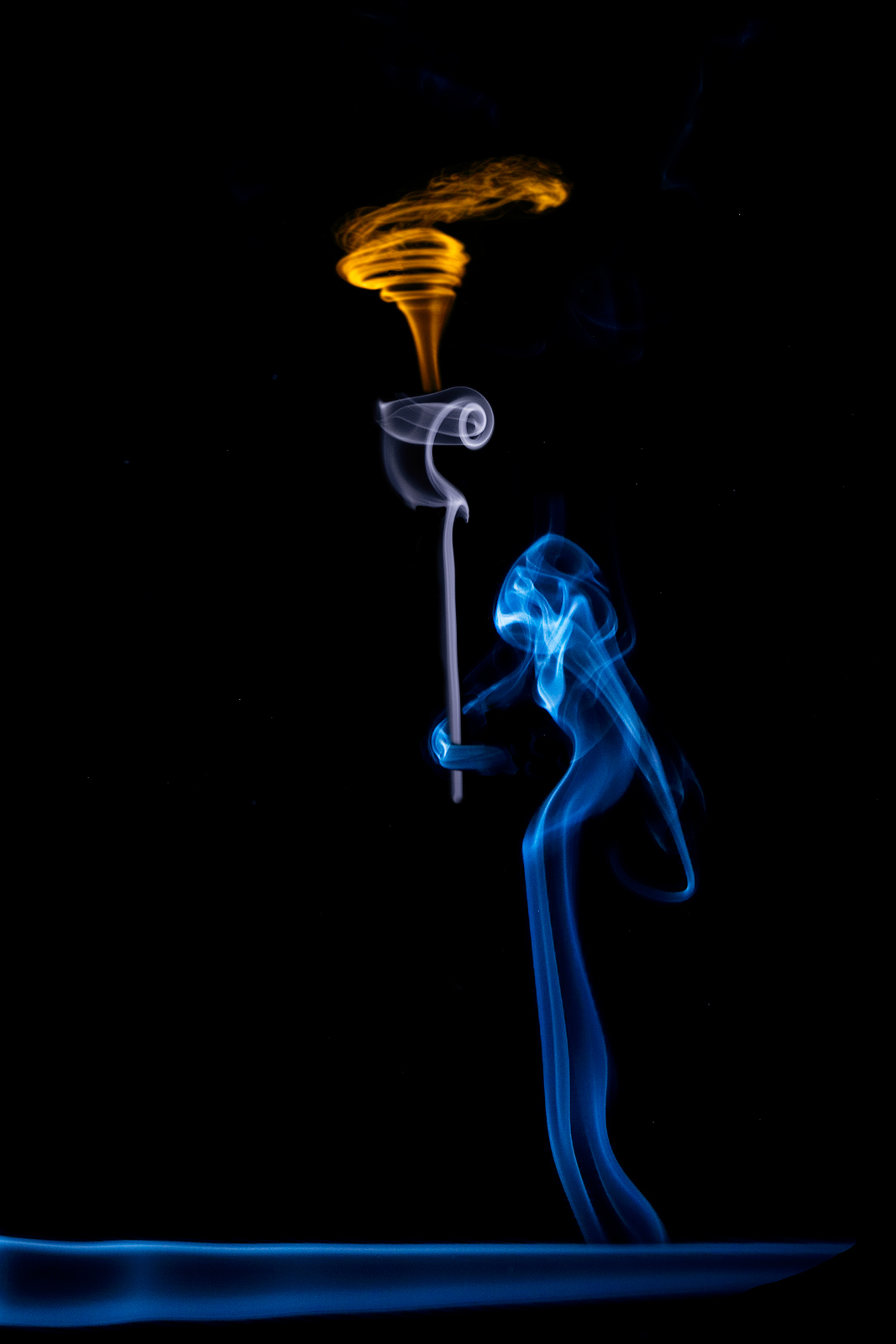 Skeleton holding torch made using smoke photography