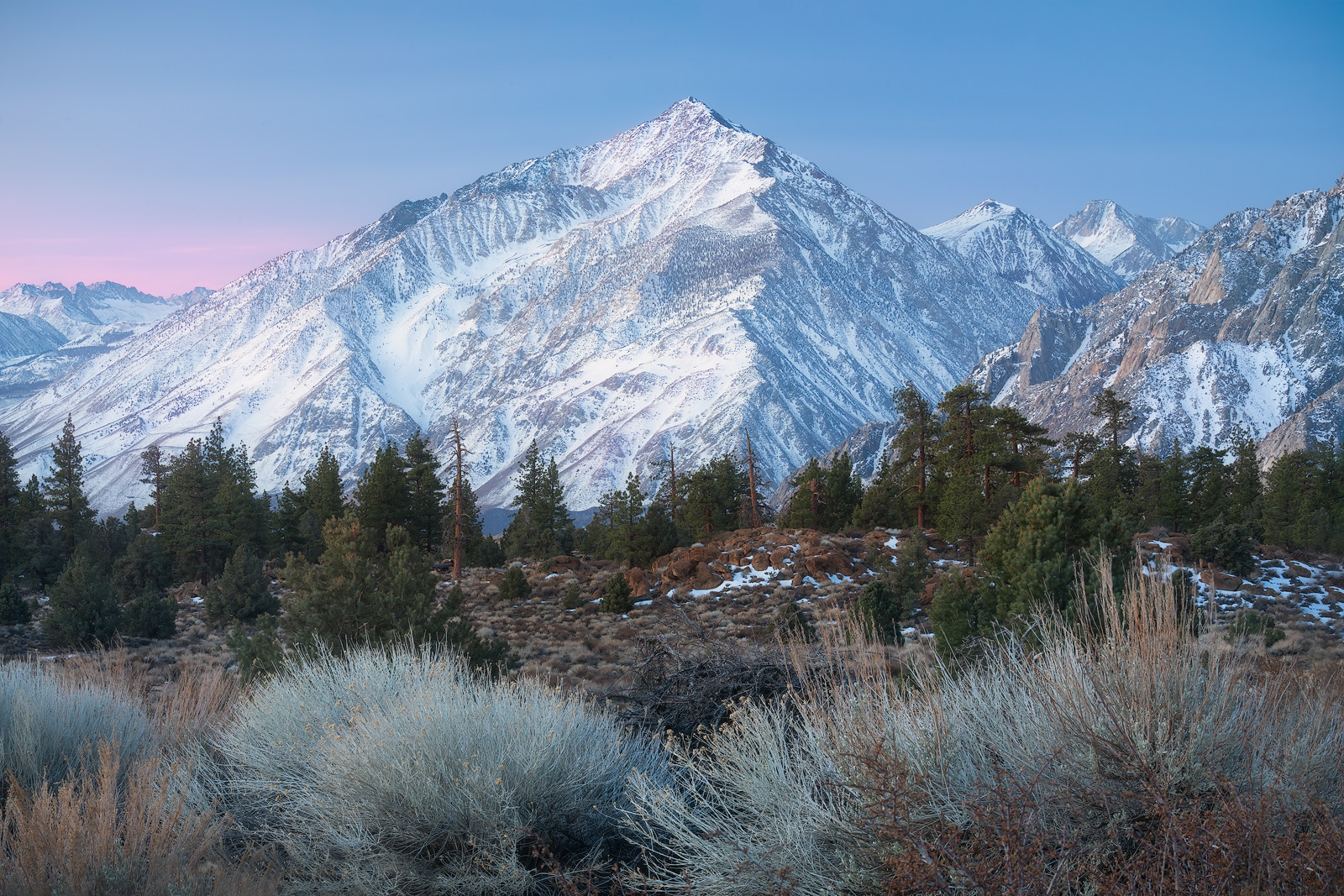 A beautiful snow-capped mountained in the Sierras just before sunrise.