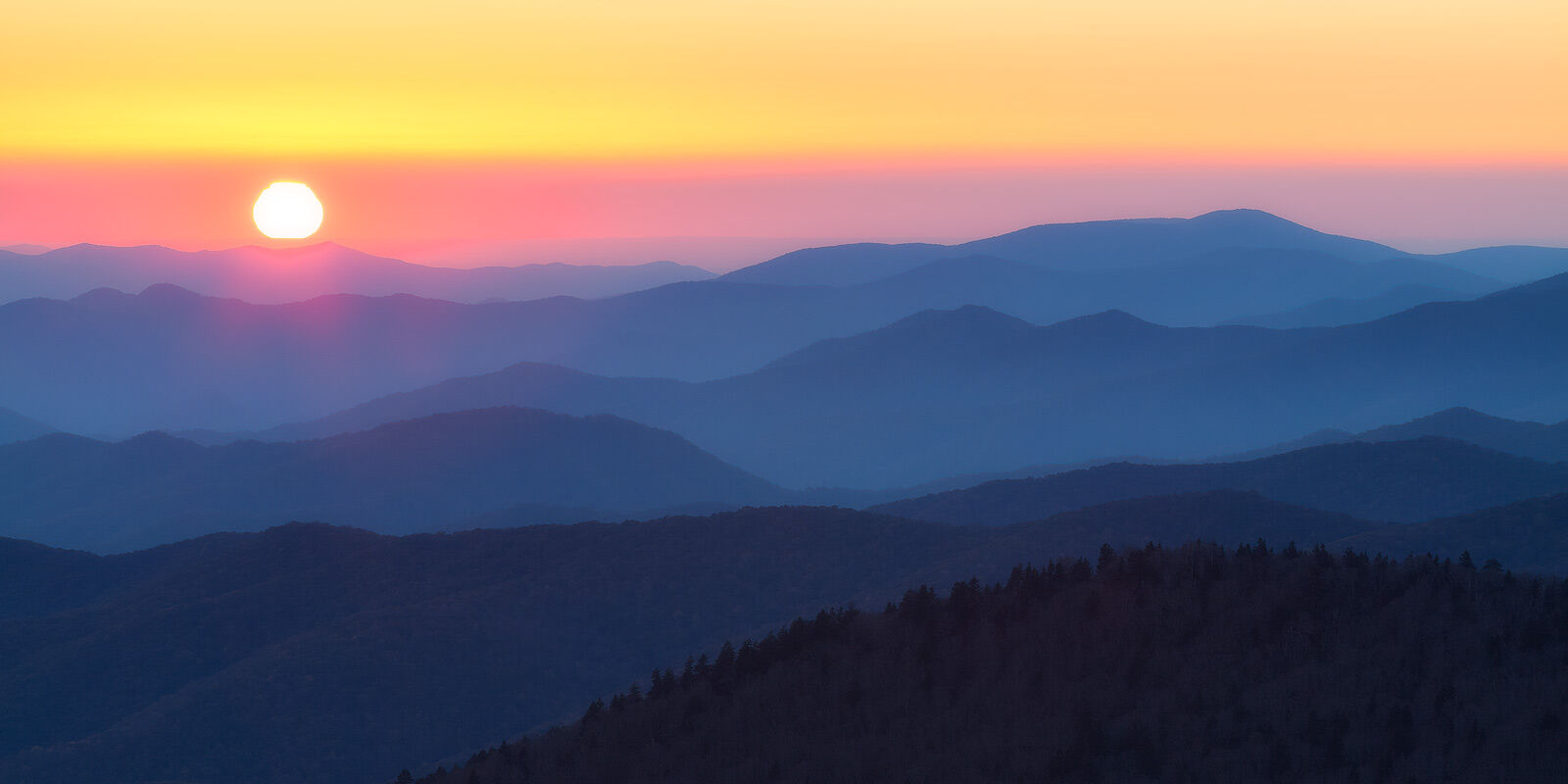 Eleventh Hour Last light over blue mountains create layers of contrast.