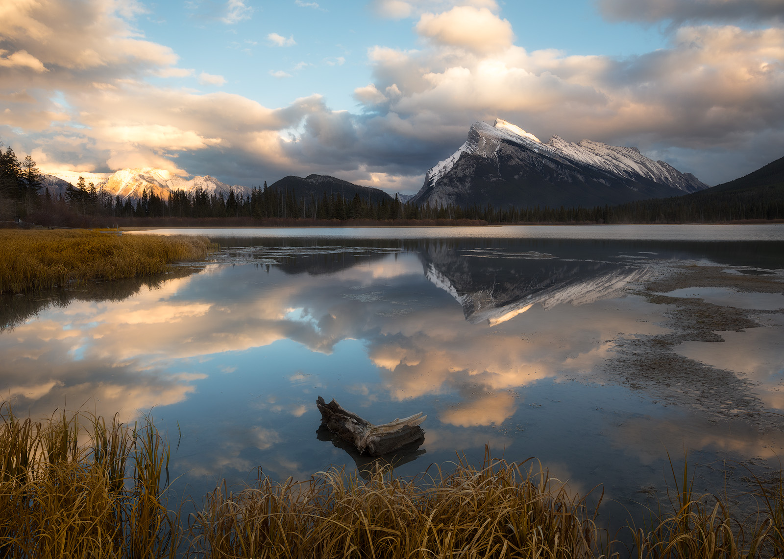 Mount Rundle reflecting in the still water of Vermillion Lakes on a quiet October evening.