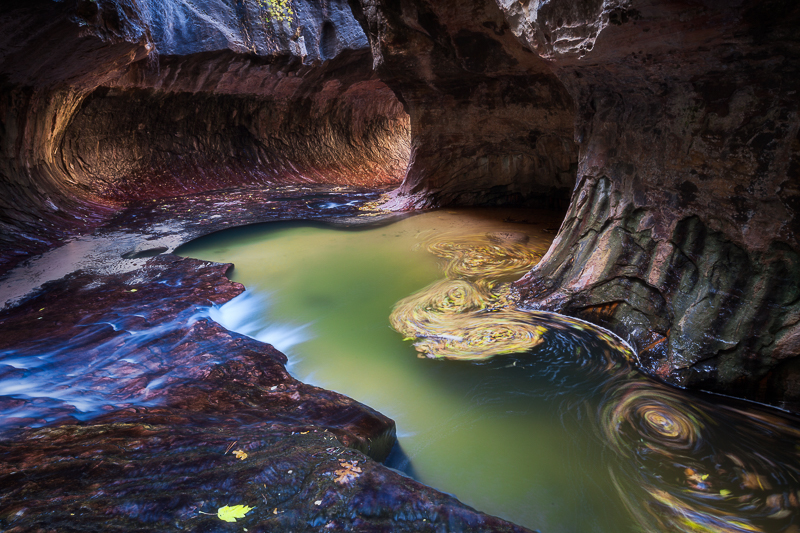 Leaves swirling in The Subway of Zion National Park.