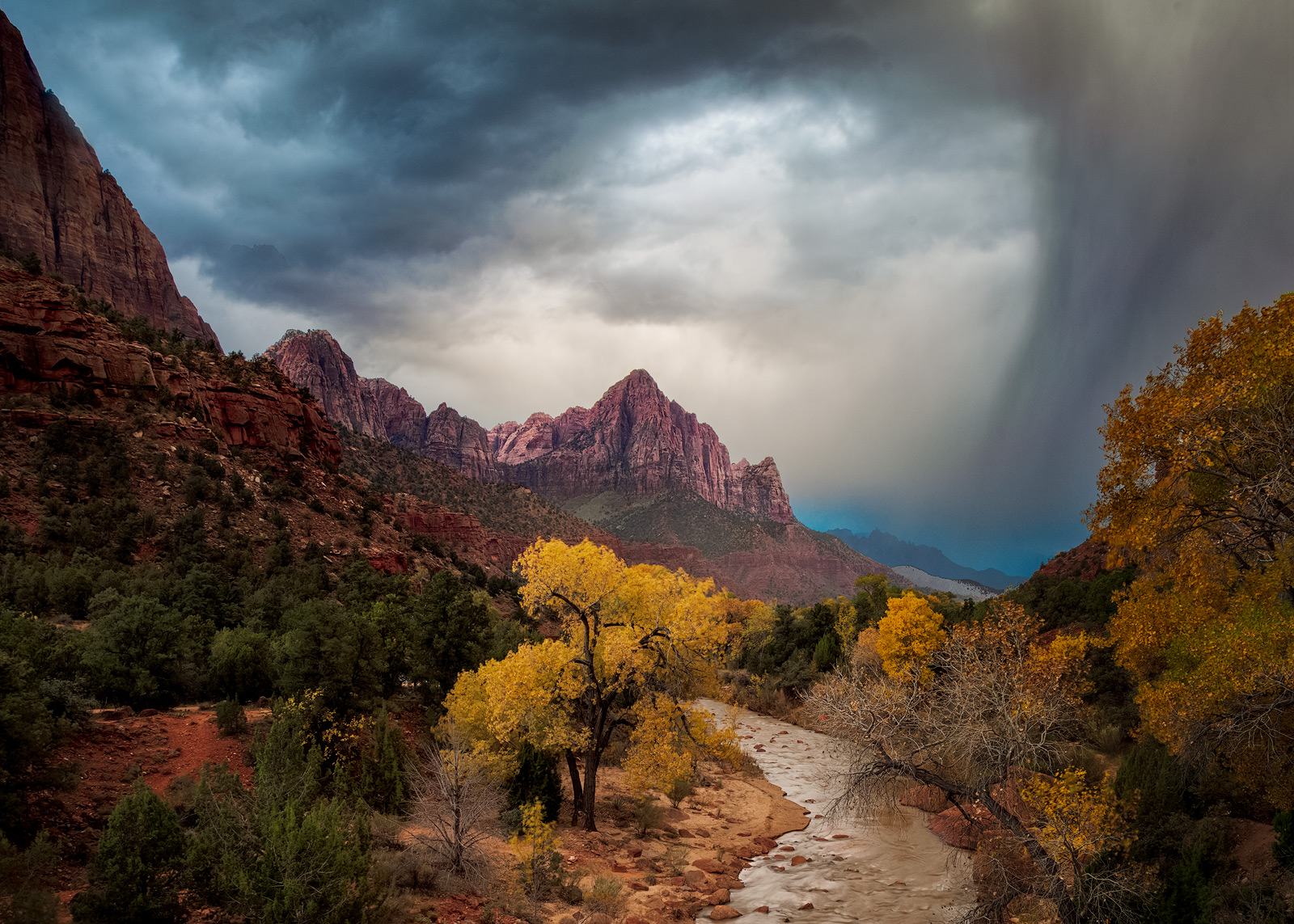 Stormy skies moving in over The Watchman in Zion National Park.